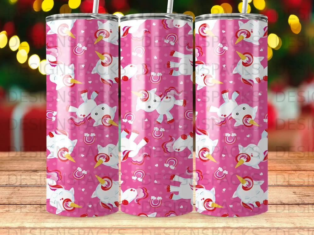 Pink tumbler with cartoon unicorns, rainbows, and clouds.