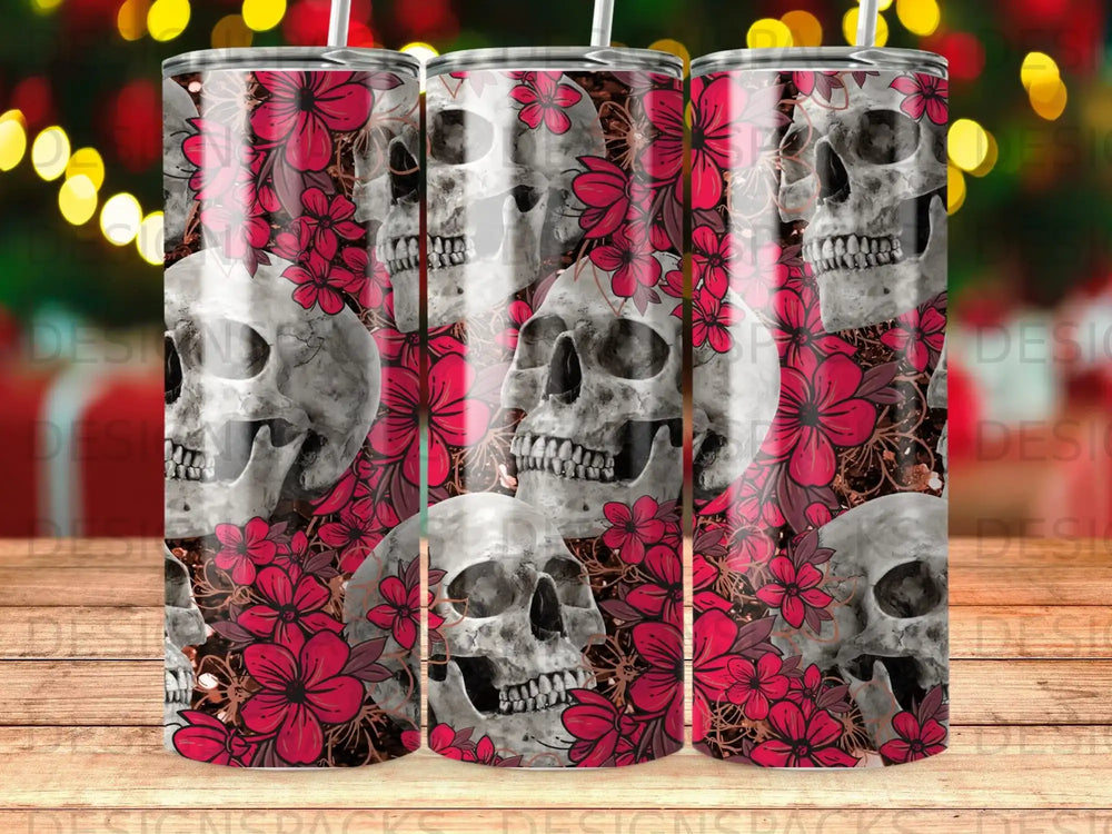 Skulls and dark red flowers on a tumbler with festive bokeh lights in background.