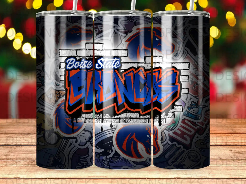 Boise State Broncos graffiti tumbler with brick and sticker background.