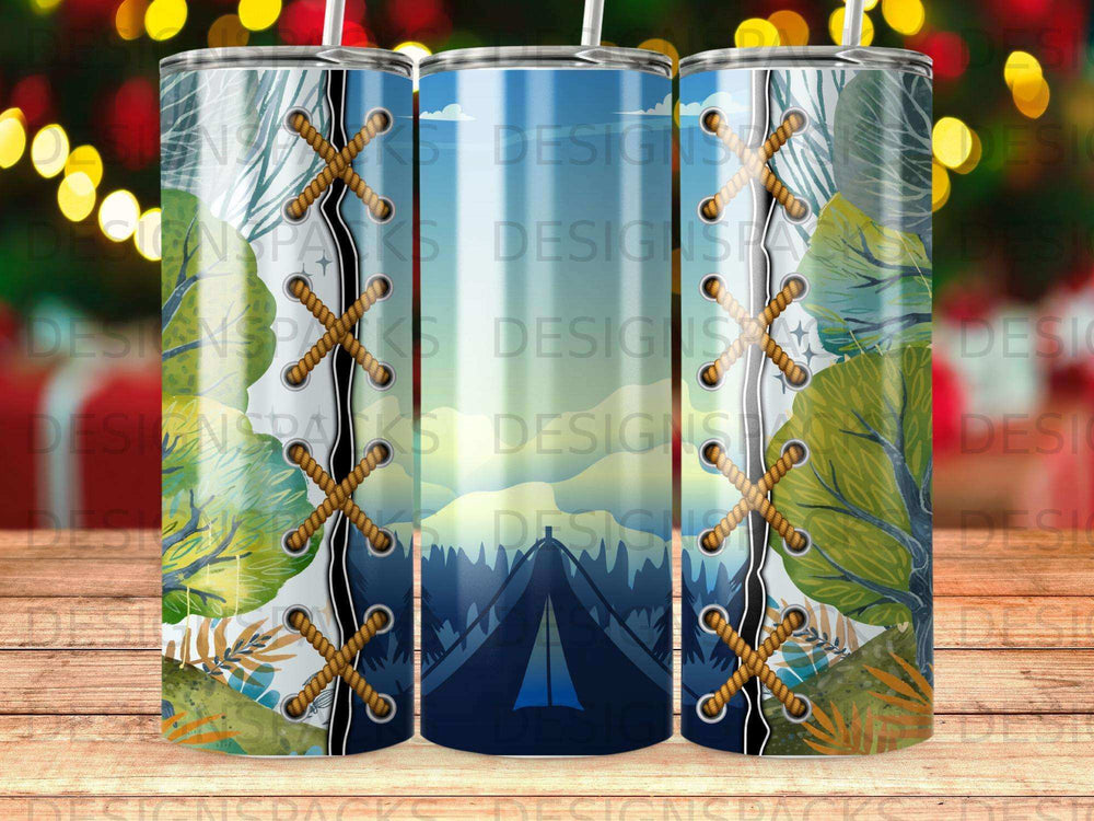 Three travel tumblers with a mountain landscape and rope tie design.
