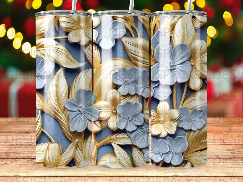 Blue tumbler with gold and blue floral embossed design.
