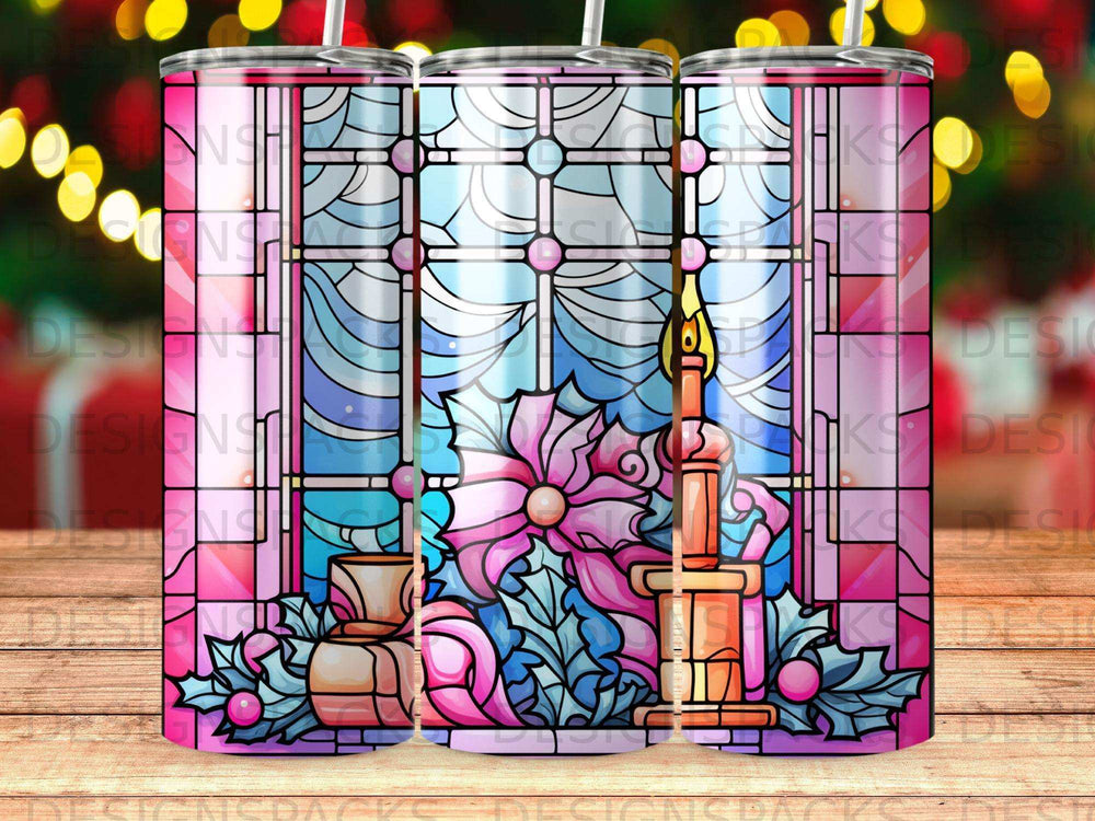 Stained glass window with poinsettia, candle, and holly design on a tumbler.