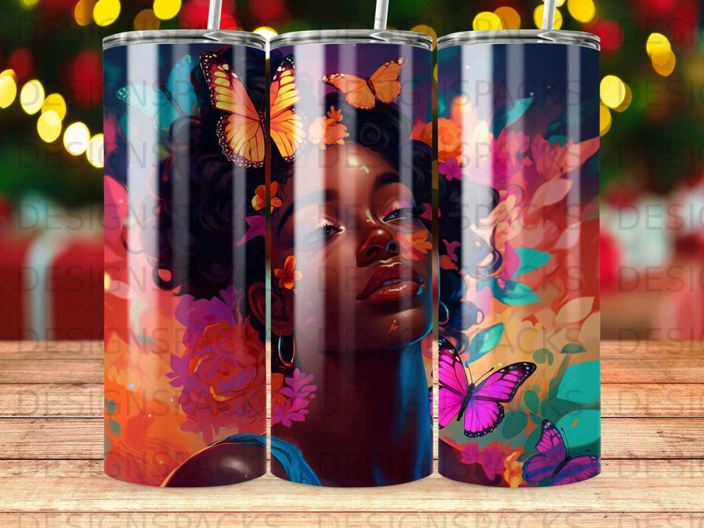 Woman's face with colorful butterflies and floral patterns on a cylindrical tumbler.