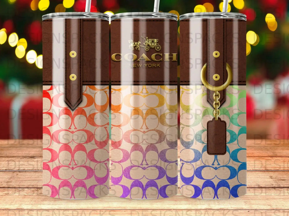 Coach New York tumbler with repeating logo pattern and keychain detail.