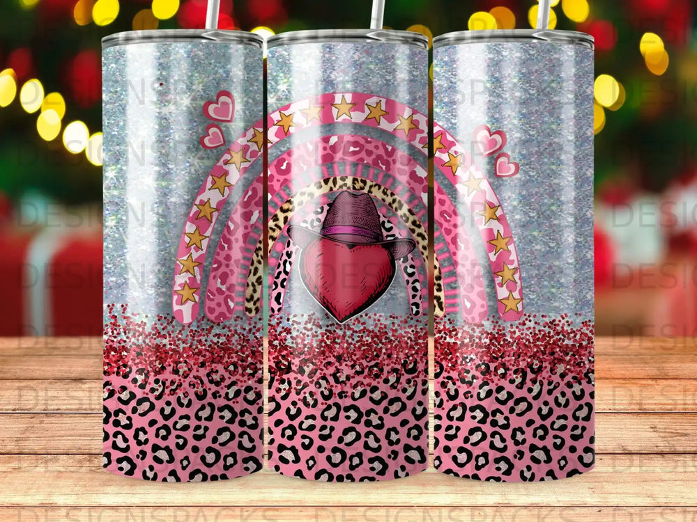 Leopard print tumbler with pink rainbow and hearts, cowboy hat.