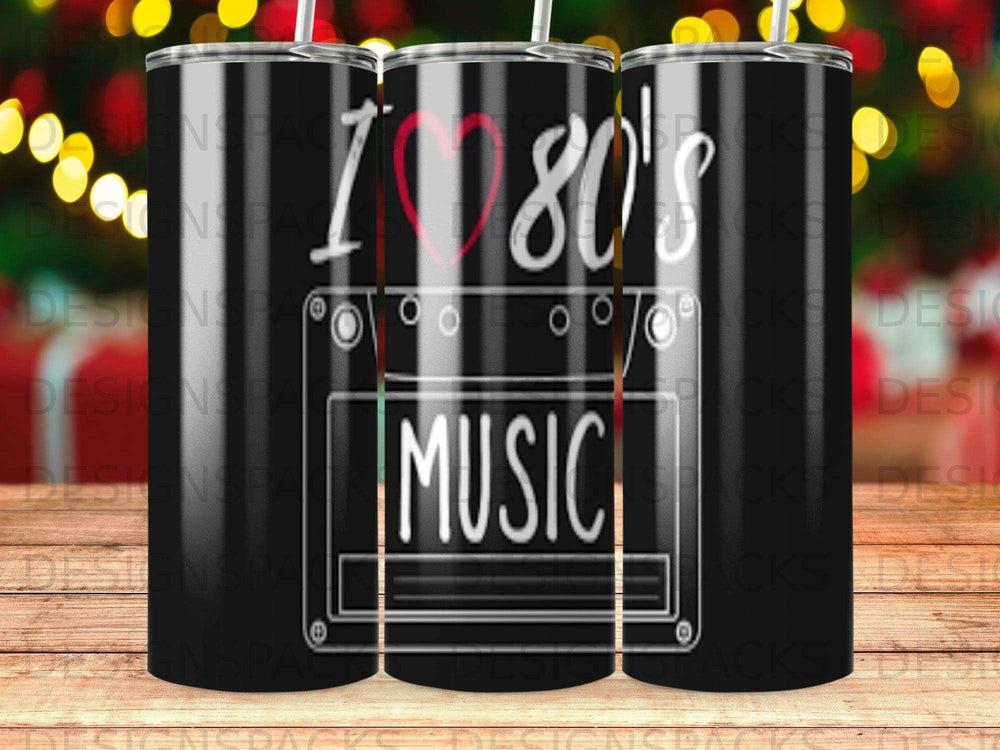 Tumbler with "I ❤️ 80's MUSIC" text and cassette tape graphic.