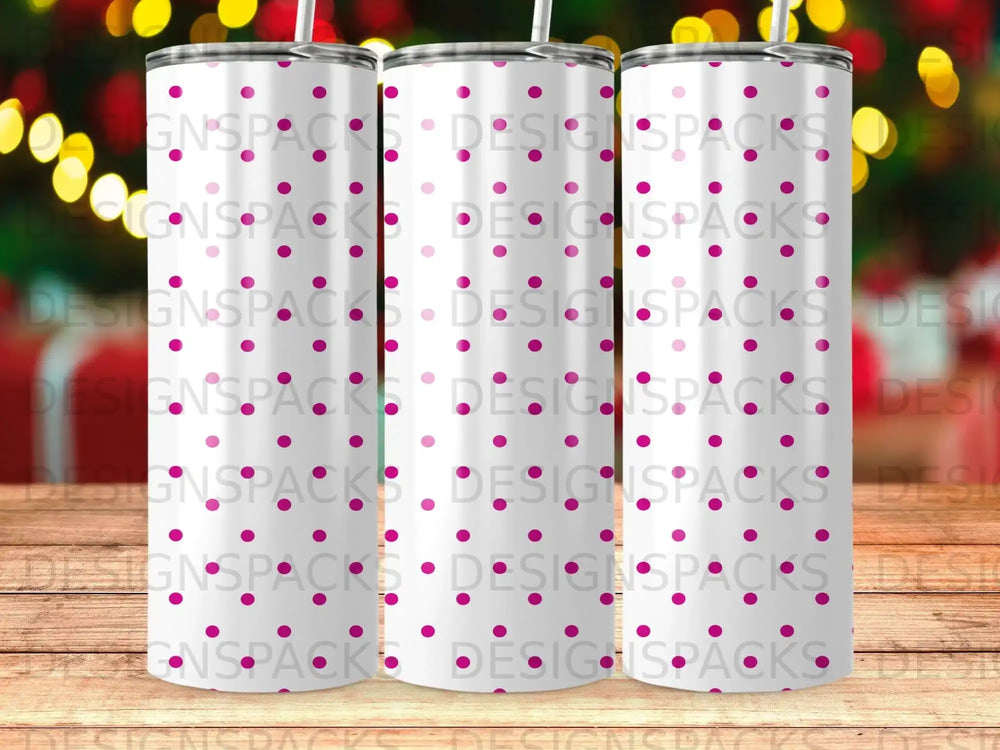 Three tall tumblers with pink polka dots on a white background.