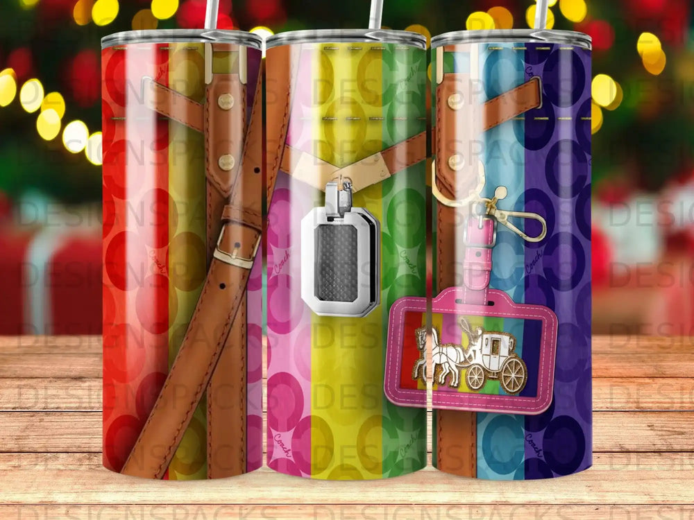 Coach tumbler with a rainbow stripe pattern and horse-drawn carriage logo.