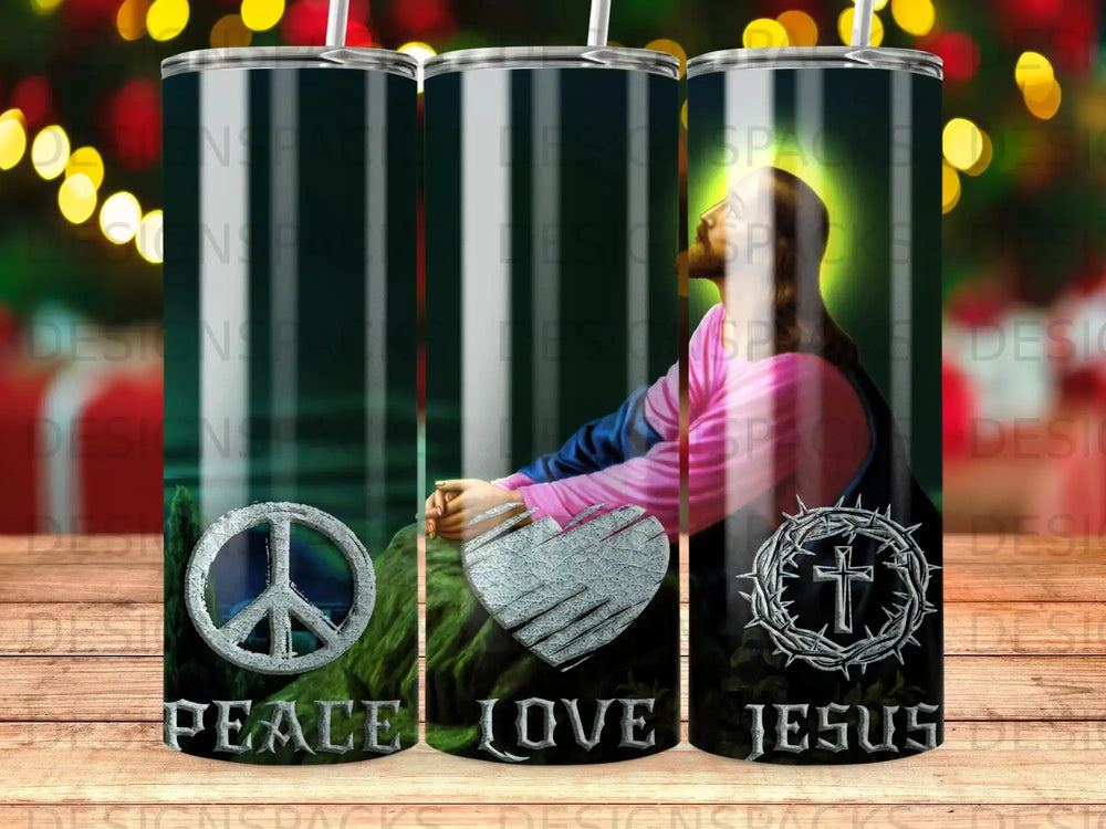 Tumbler with peace sign, heart, and cross designs.