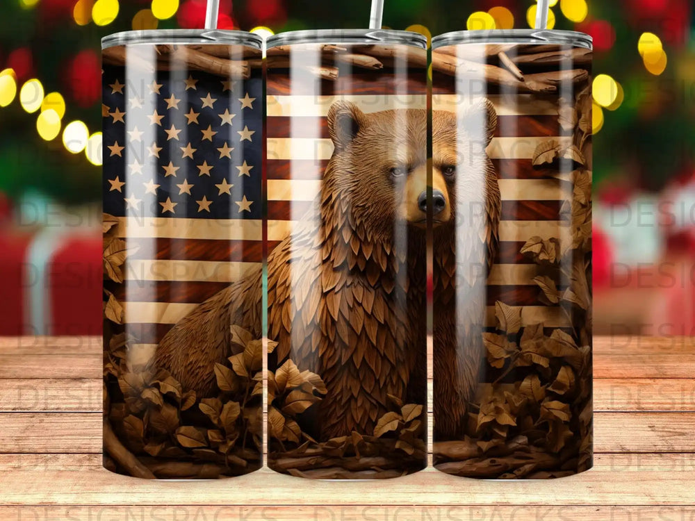 Bear and American flag pattern on a tumbler with fallen leaves.