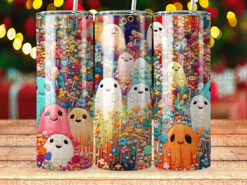 Spooky cute ghosts with embroidered floral details on a colorful tumbler.