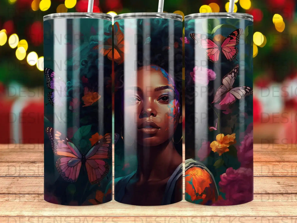 Woman with colorful butterfly and floral accents on tumbler.