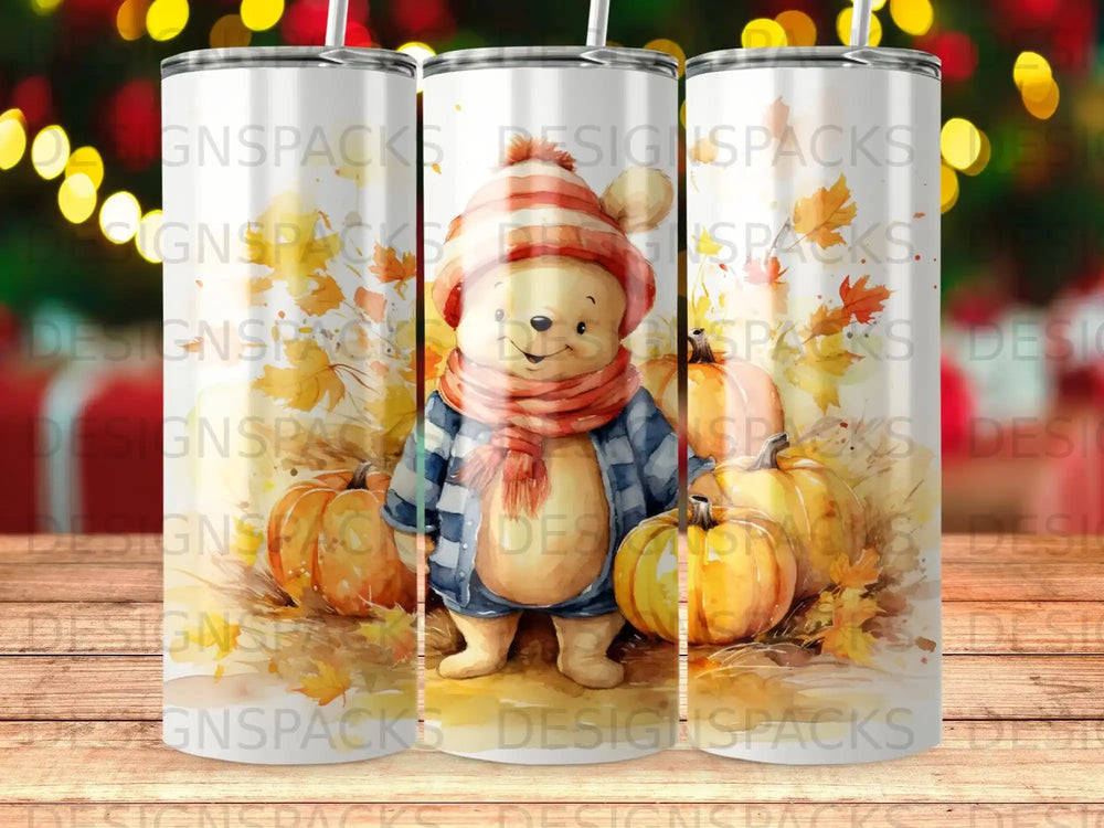 Bear wearing scarf and hat standing among pumpkins and autumn leaves.