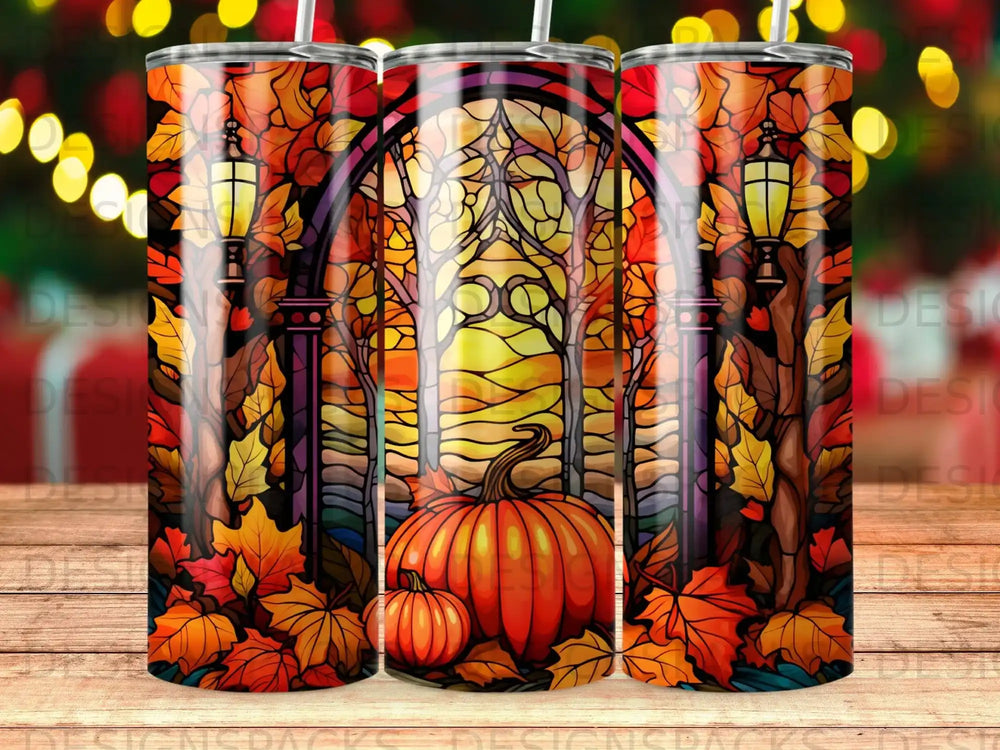 Stained glass pumpkin and fall leaves pattern on a tumbler.