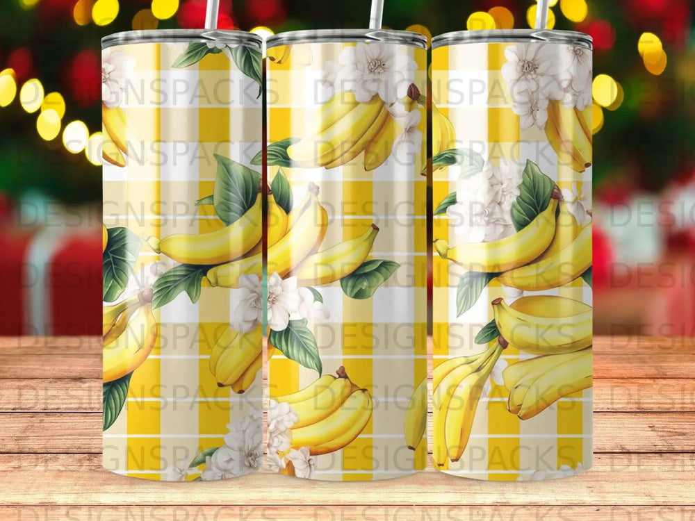 Yellow bananas and white flowers on a checkered background tumbler.