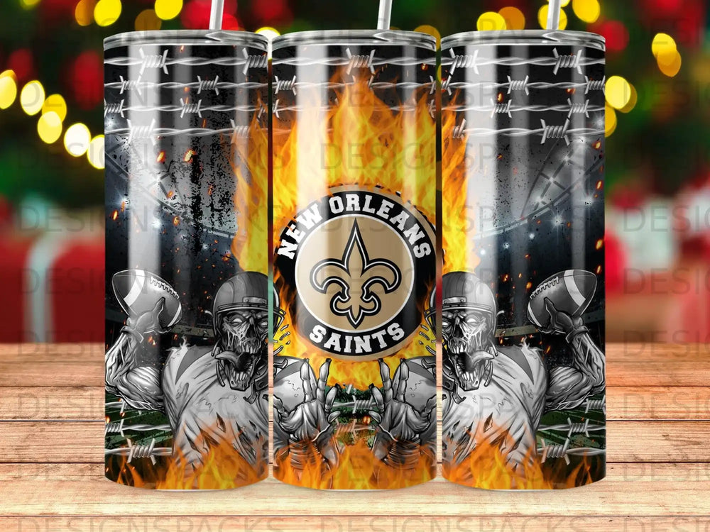 New Orleans Saints football tumbler with fiery background and skeletal figures.