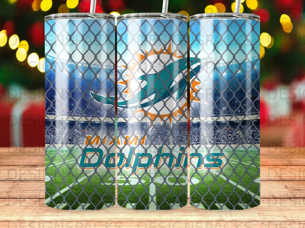 Miami Dolphins logo and wordmark on stadium background seen through chain-link fence.
