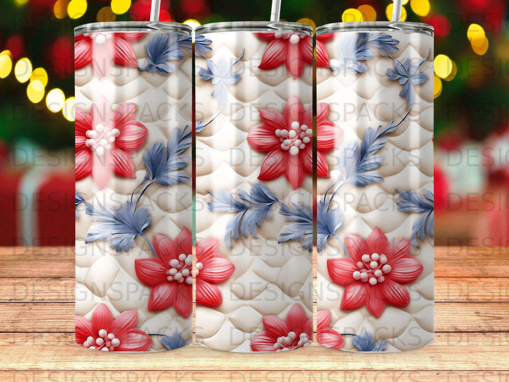 Tumbler with red floral and blue leaf pattern on a white quilted background.