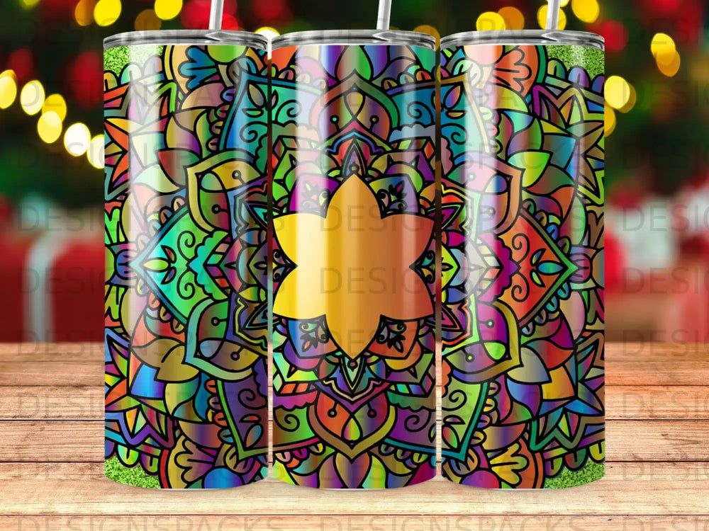 Colorful mandala tumbler with glitter accents and bokeh background.