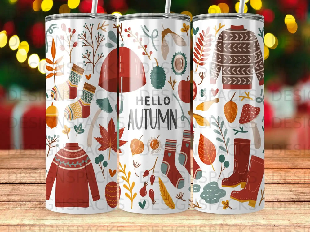 Autumn themed tumbler with leaves, pumpkins, sweaters, and socks.