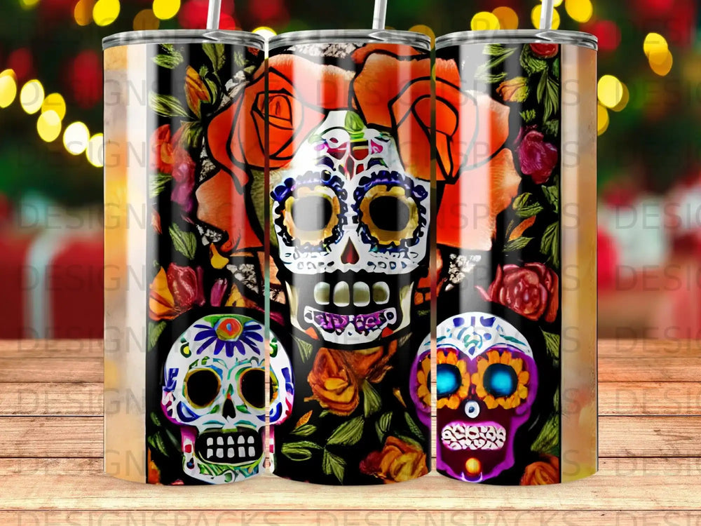Sugar skull tumblers with floral accents and bokeh background.