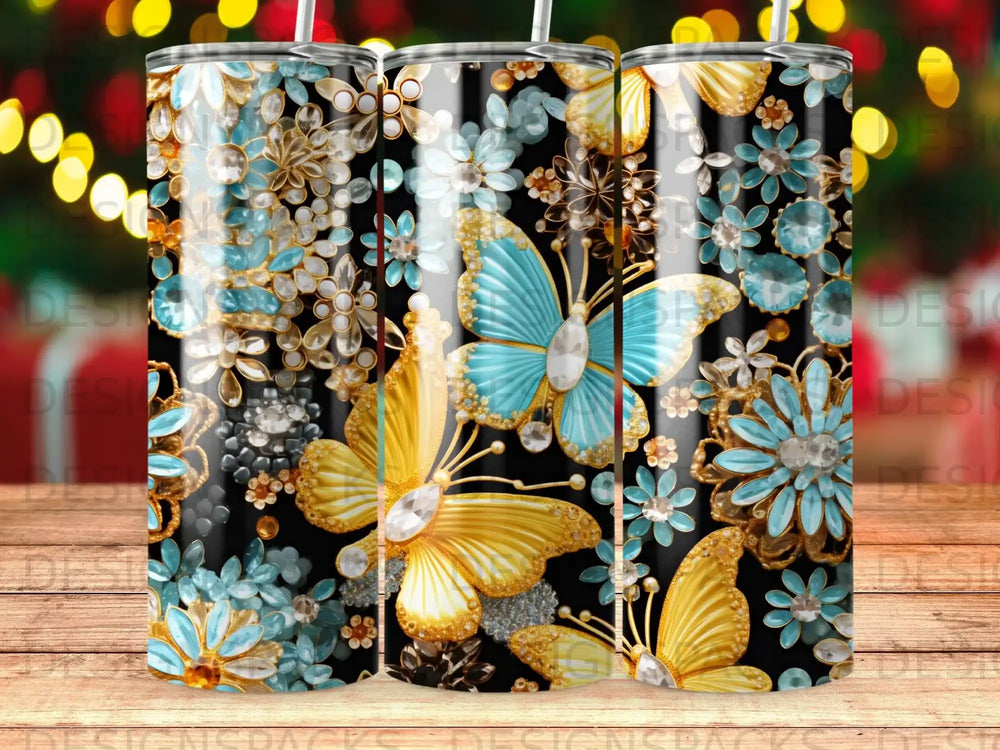 Black tumbler with golden butterflies and blue crystal floral designs.
