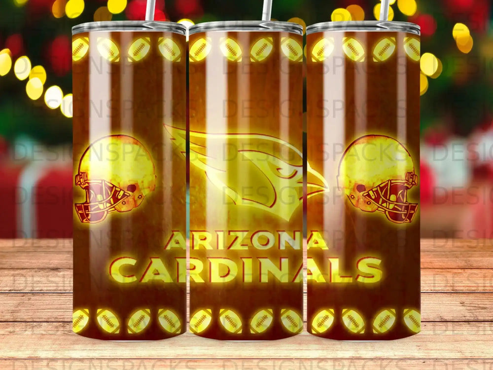 Arizona Cardinals logo and helmet on a tumbler with football and bokeh lights background.