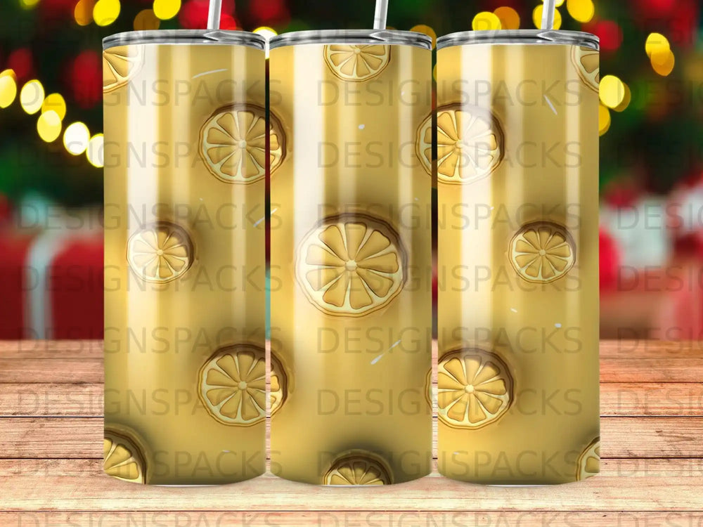 Three tumblers with a repeating lemon slice pattern.