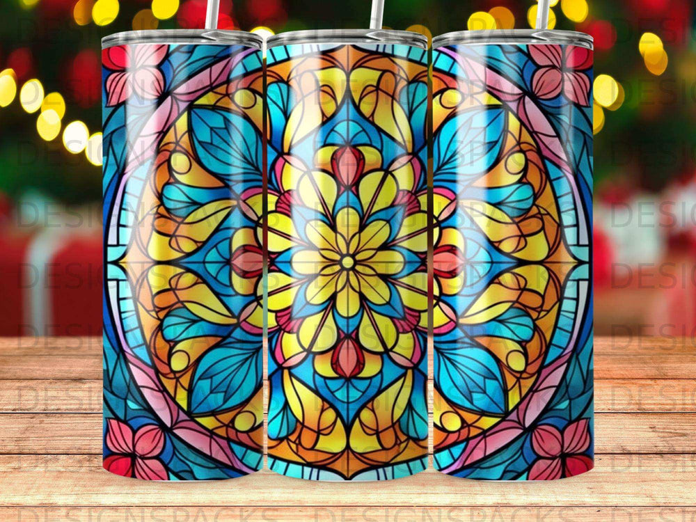Three stained glass tumblers with a floral mandala pattern.