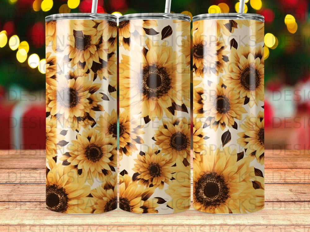 Sunflower pattern on a tapered tumbler with a blurred holiday lights background.