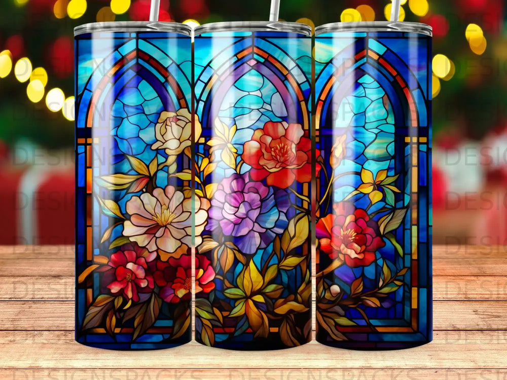 Three stained glass tumblers featuring colorful floral designs.