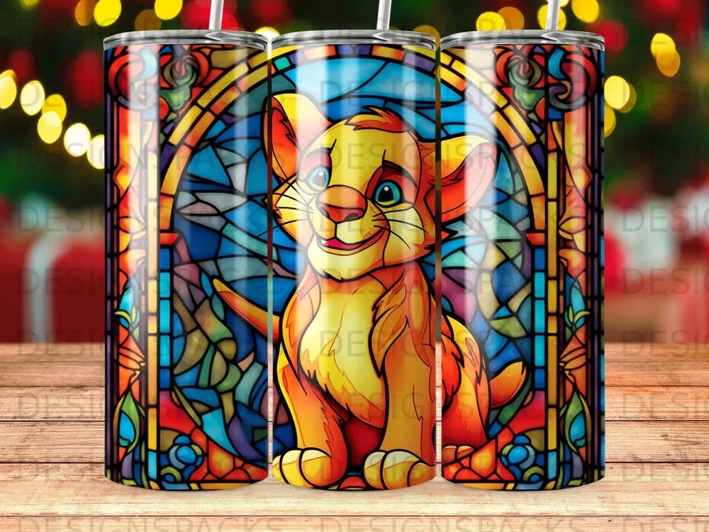 Stained glass Simba from The Lion King on a tumbler with blurred lights.