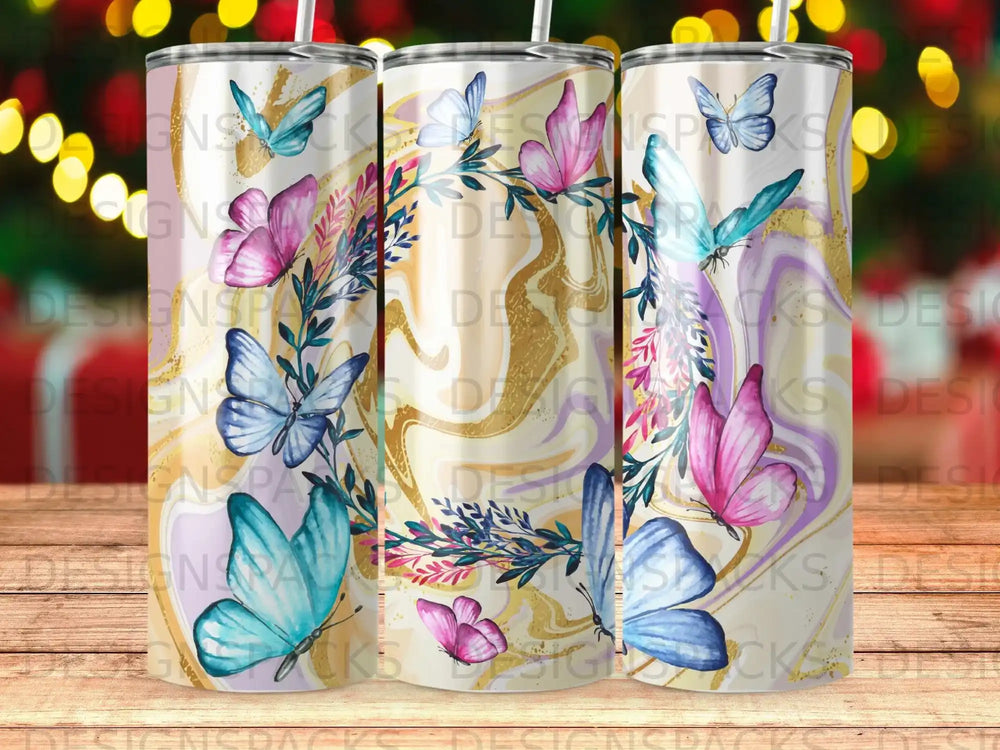 Floral and butterfly design on three insulated tumblers.
