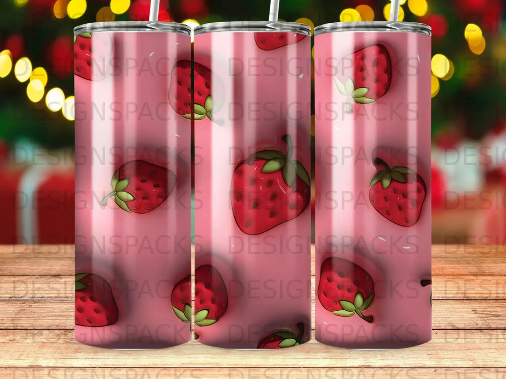 Pink tumbler with strawberry pattern and "DESIGNSPACKS" watermark.