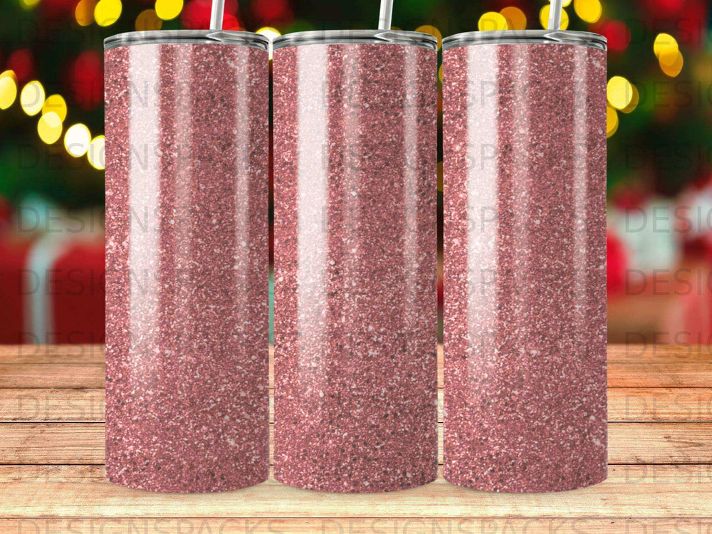 Pink glitter tumbler with a repeating watermark pattern of "DESIGNSPACKS".