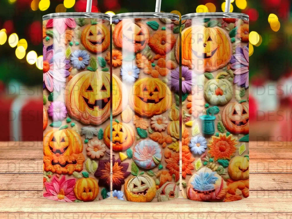 Halloween pumpkins and floral patterns on a tumbler.
