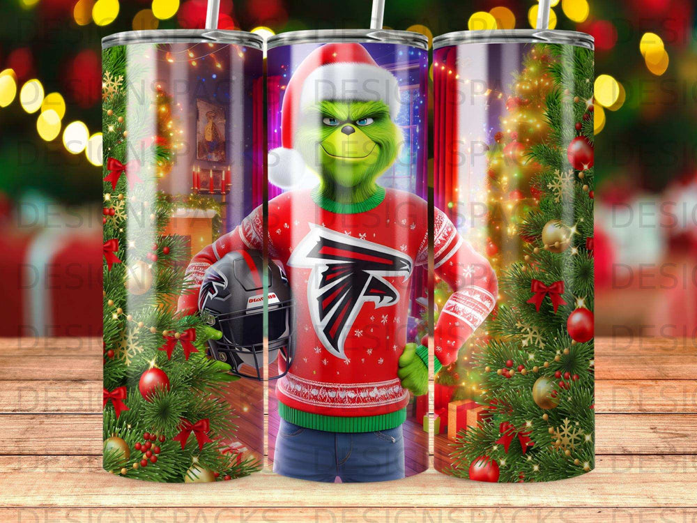 Grinch in a Santa hat and Falcons sweater holding a helmet, surrounded by Christmas decorations.