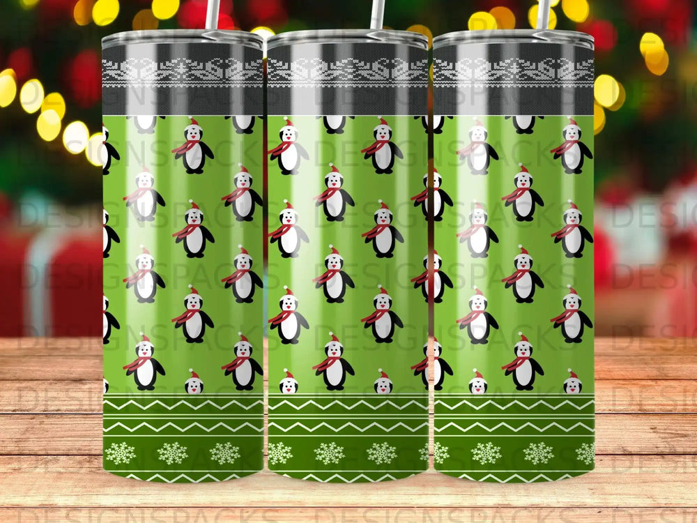 Green tumbler with repeating penguin and snowflake pattern.