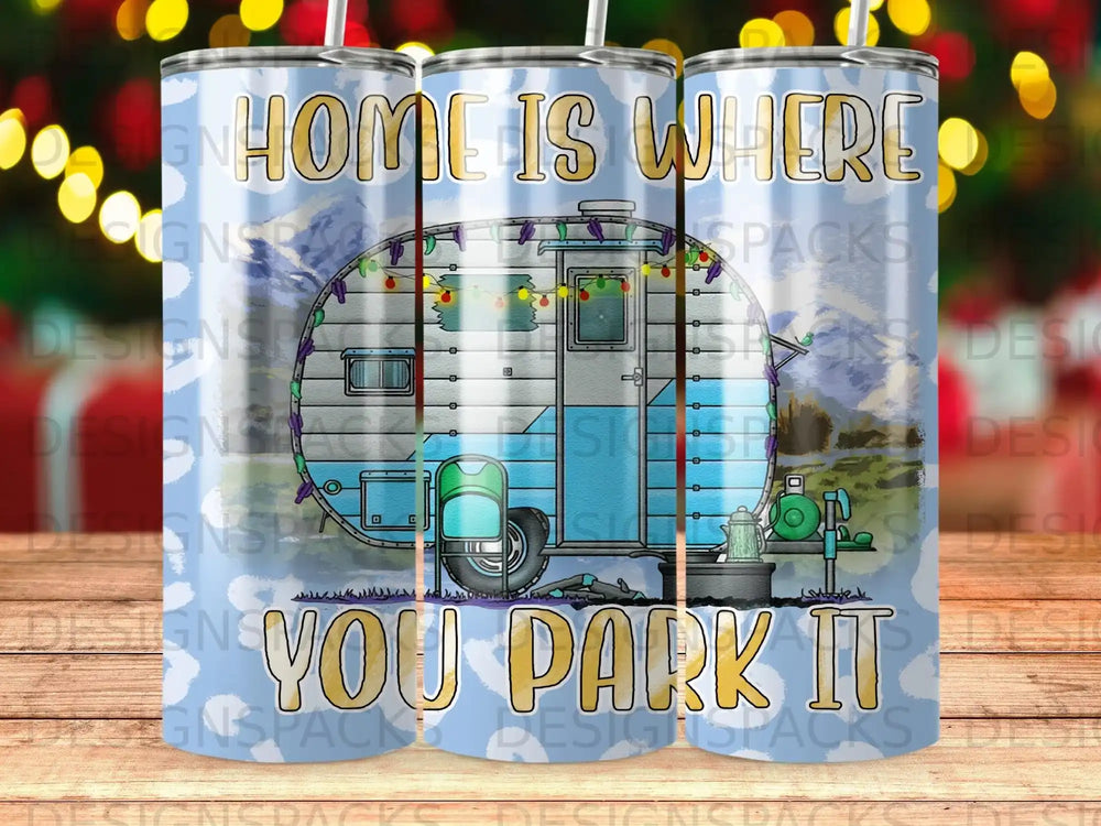 Blue camper trailer with "Home is where you park it" text.