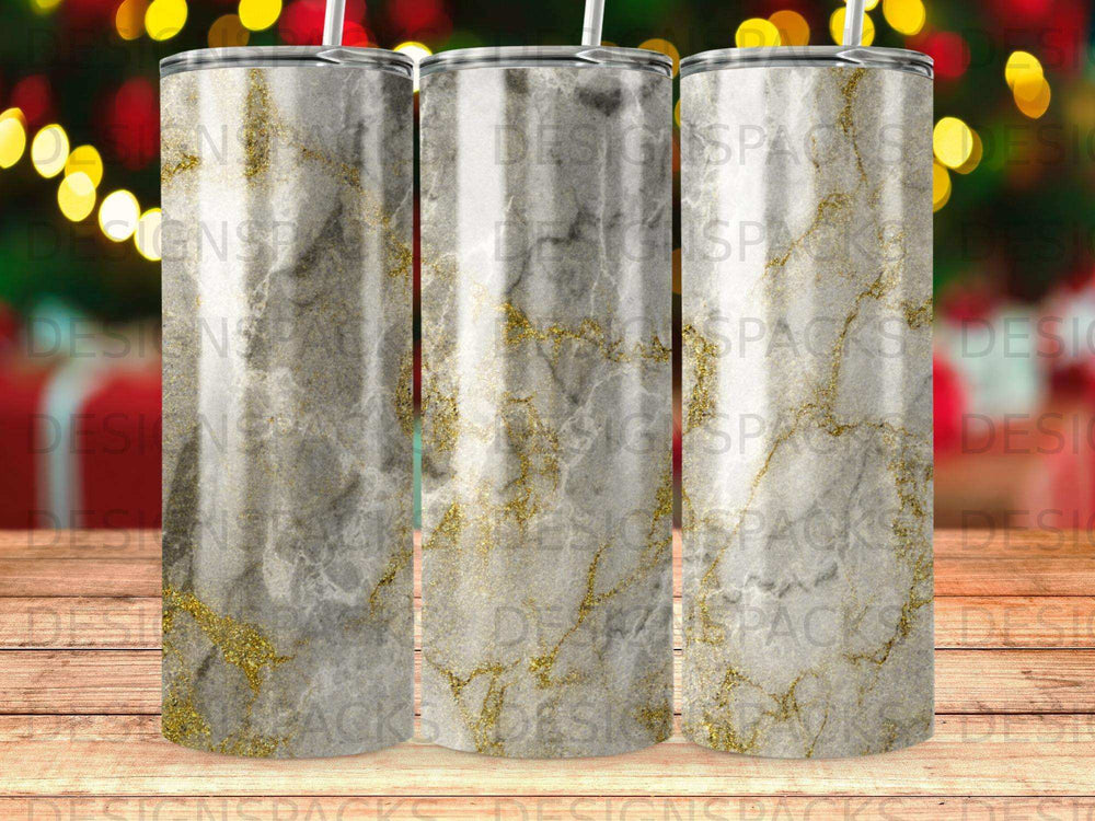 Three tumblers with a gray and gold marble pattern.