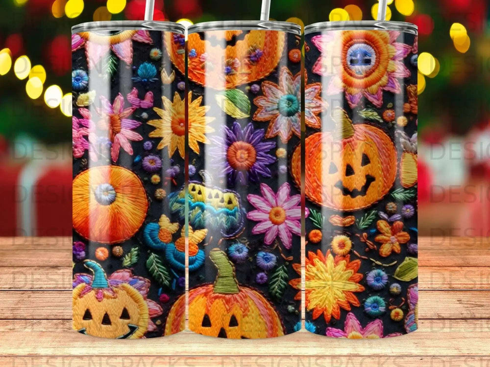 Halloween tumbler with embroidered pumpkins, flowers, and stars.