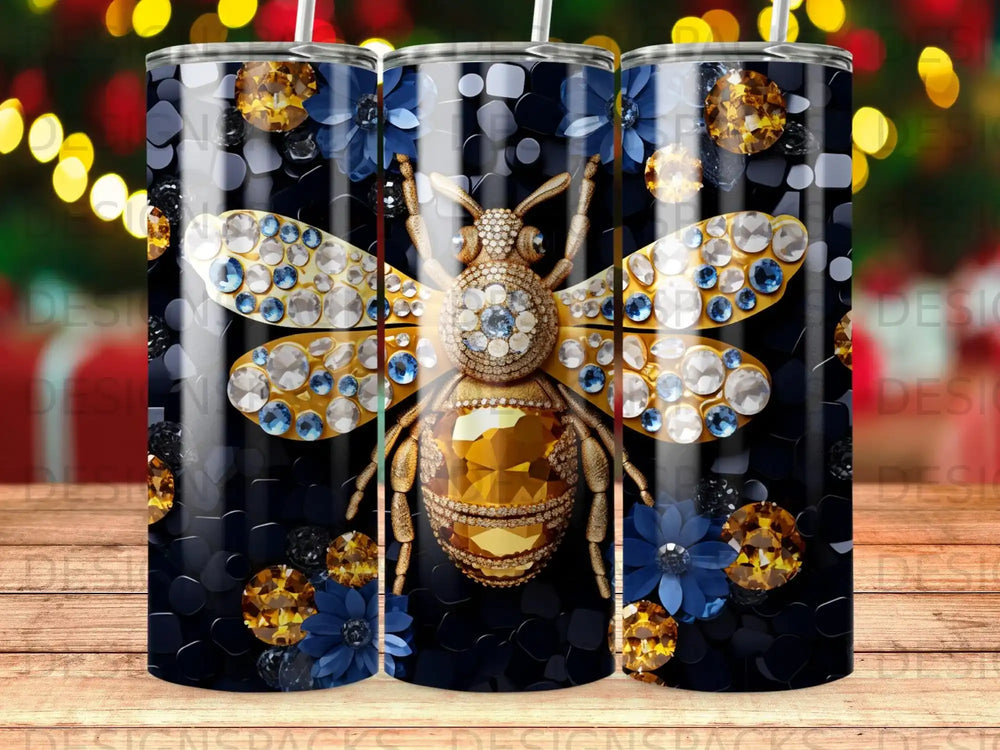 Gold jeweled bee with blue and yellow flowers on a black textured background.