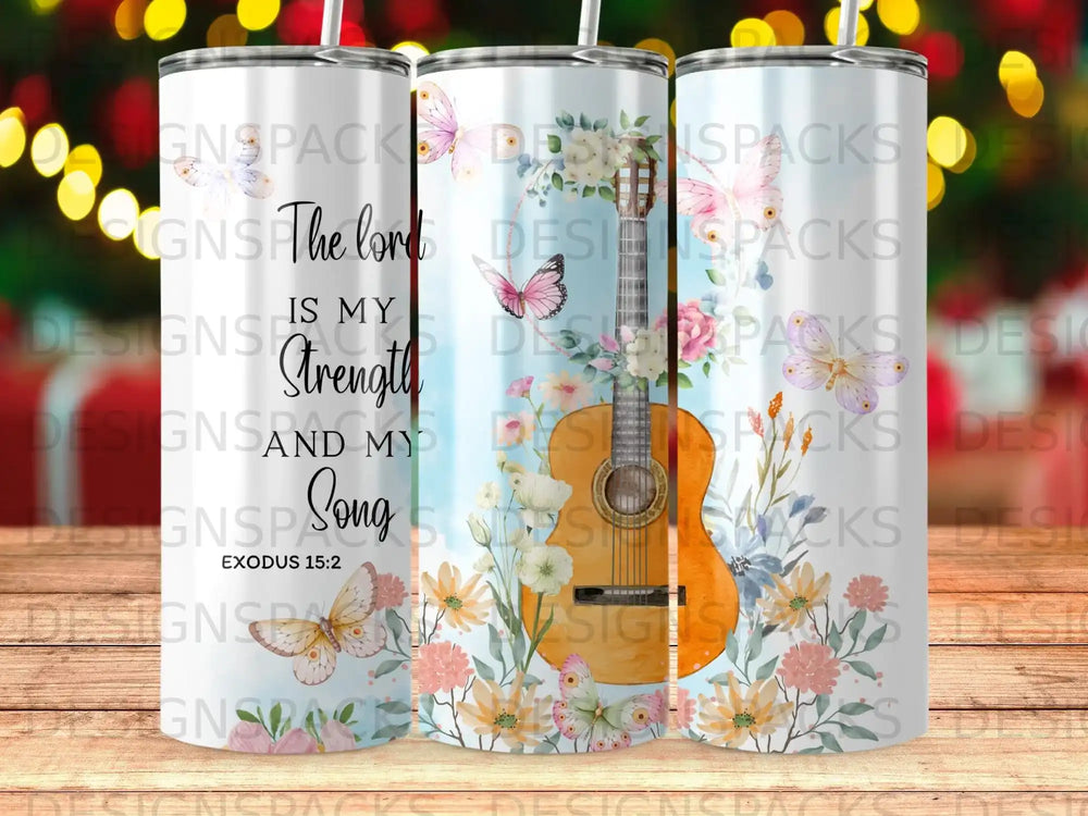 A tumbler with a floral and butterfly design and the text "The Lord is Strength and Song" and "Exodus 15:2".