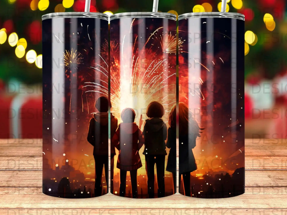 Tumbler with silhouetted figures watching a fireworks display.