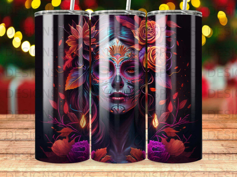 Day of the Dead skull adorned with flowers and vibrant colors on a tumbler.
