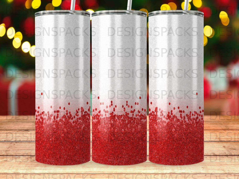 Three tumblers with red glitter at the bottom against a blurred bokeh background.