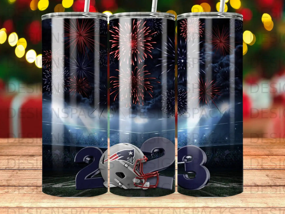 New England Patriots helmet and "2023" with fireworks over stadium.