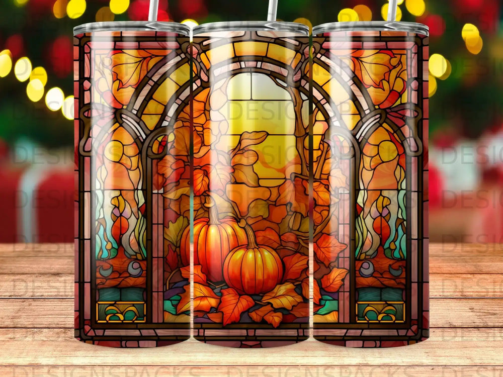 Stained glass tumbler with pumpkins and autumn leaves.