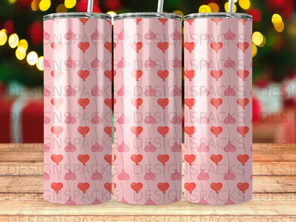 Pattern of pink hearts and watermarks reading "DESIGNSPACKS" on tumblers.