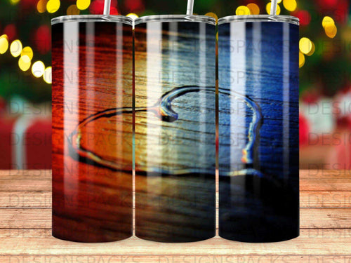 Three stainless steel tumblers with a gradient of red, orange, and blue.